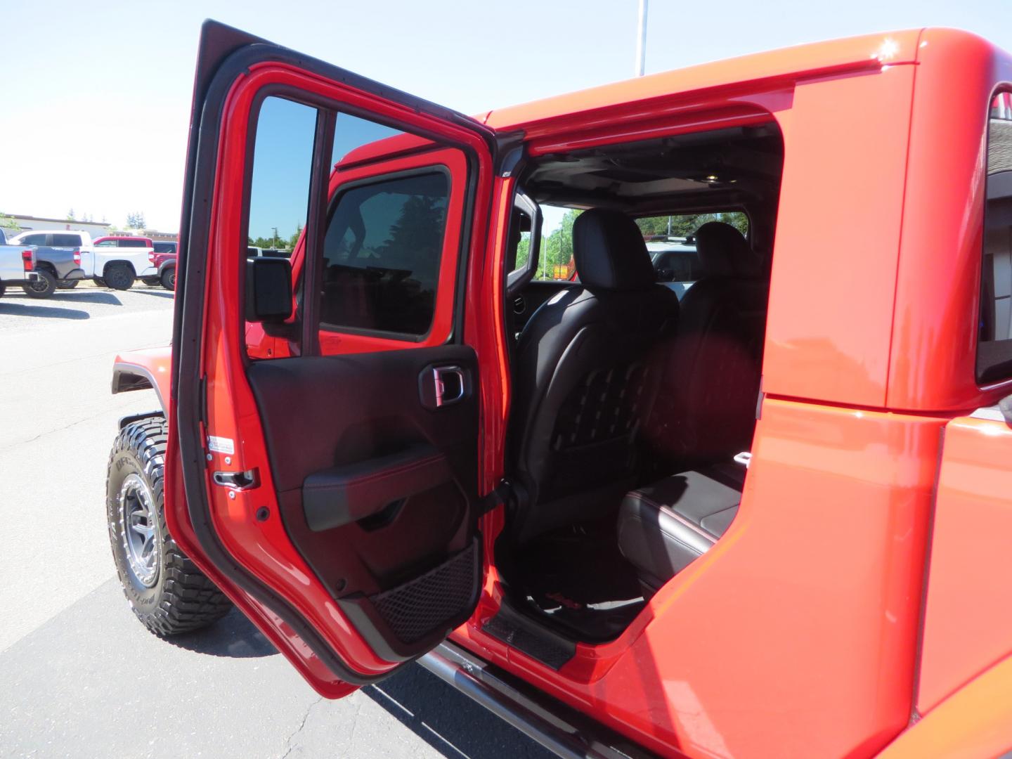 2020 Red /black Jeep Gladiator Rubicon (1C6JJTBG6LL) with an 3.6L V6 DOHC 24V engine, 6M transmission, located at 2630 Grass Valley Highway, Auburn, CA, 95603, (530) 508-5100, 38.937893, -121.095482 - Rubicon Gladiator featuring a Mopar suspension system with Fox shocks, 17" AEV wheels wrapped in 37" BFG tires, Warn Winch, Rock sliders, Cascade front license plate holder, Impact bedliner, Built Right Industries bed Molle panels, and Window tint. - Photo#39